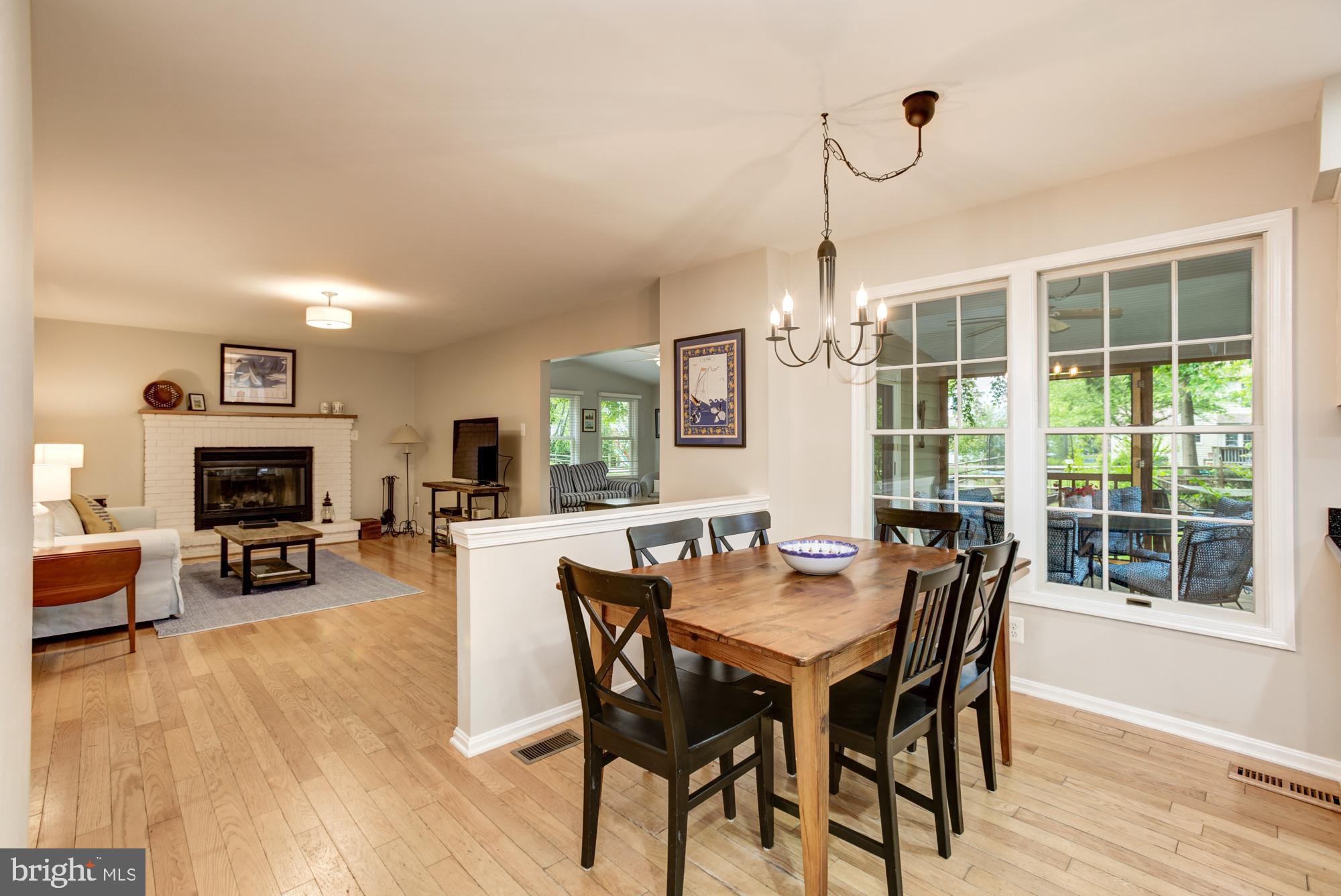 326 Riding Ridge Road Annapolis, MD 21403 - Photo 15 of 63 a view of a dining room with furniture window and wooden floor