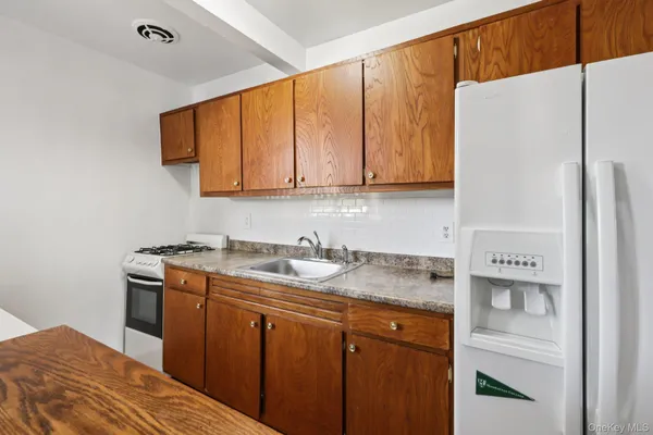 a view of an empty room and wooden floor