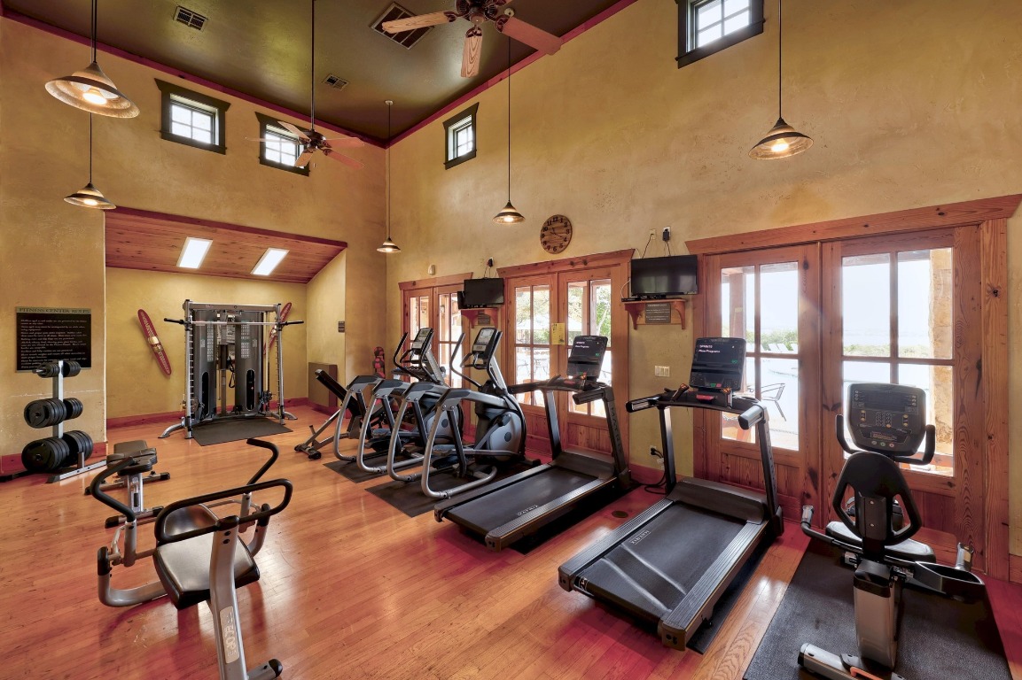 6909 Sunset Ridge Way Jonestown, TX 78645 - Photo 26 of 40 a room with gym equipment and view of living room