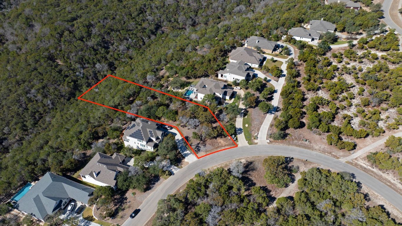 6909 Sunset Ridge Way Jonestown, TX 78645 - Photo 3 of 40 an aerial view of a house with a yard and mountain