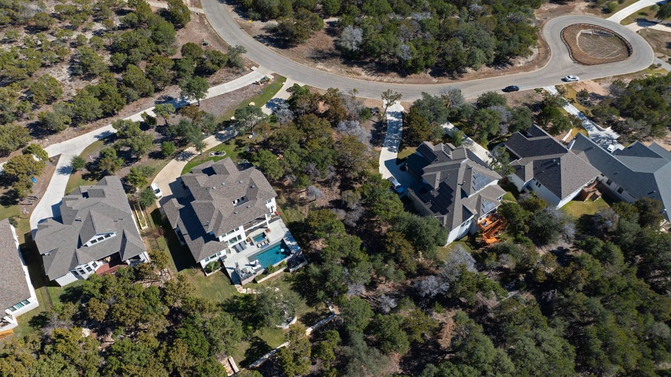 6909 Sunset Ridge Way Jonestown, TX 78645 - Photo 9 of 40 an aerial view of multiple house