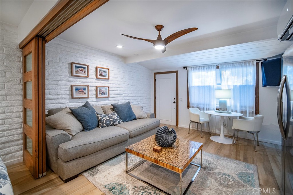 33921 Robles Drive, Unit C Dana Point, CA 92629 - Photo 11 of 17 a living room with furniture and a view of kitchen