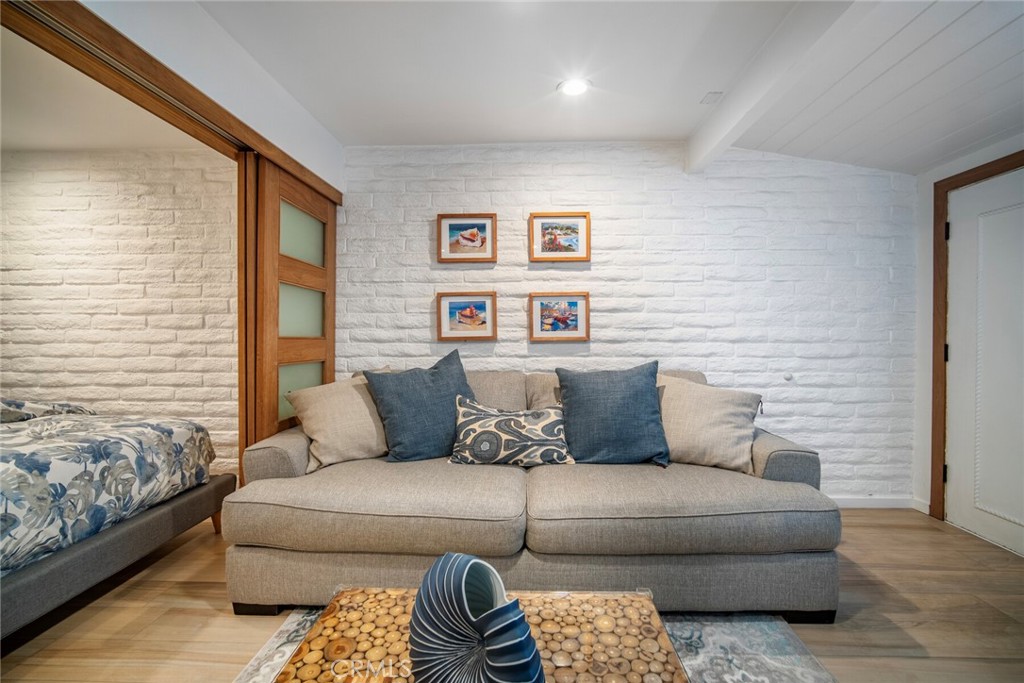 33921 Robles Drive, Unit C Dana Point, CA 92629 - Photo 13 of 17 a living room with furniture and a couch
