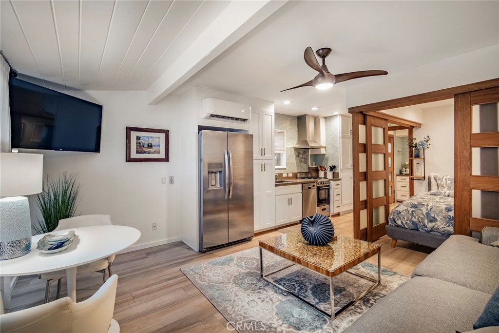 33921 Robles Drive, Unit C Dana Point, CA 92629 - Photo 3 of 17 a living room with furniture and a floor to ceiling window