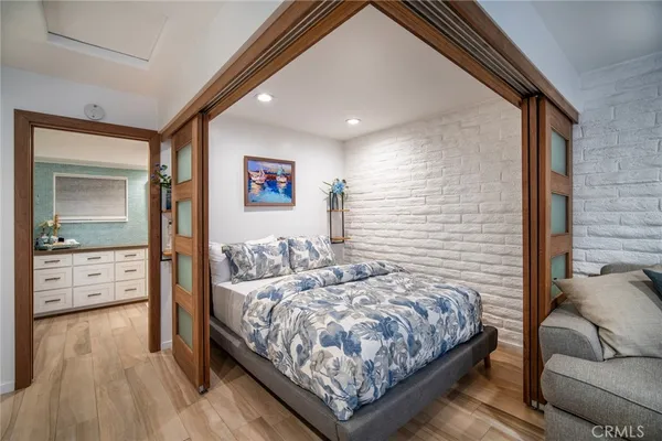 a bedroom with a bed and a couch