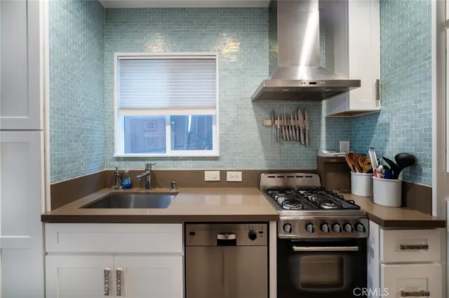 a kitchen with a stove and a sink