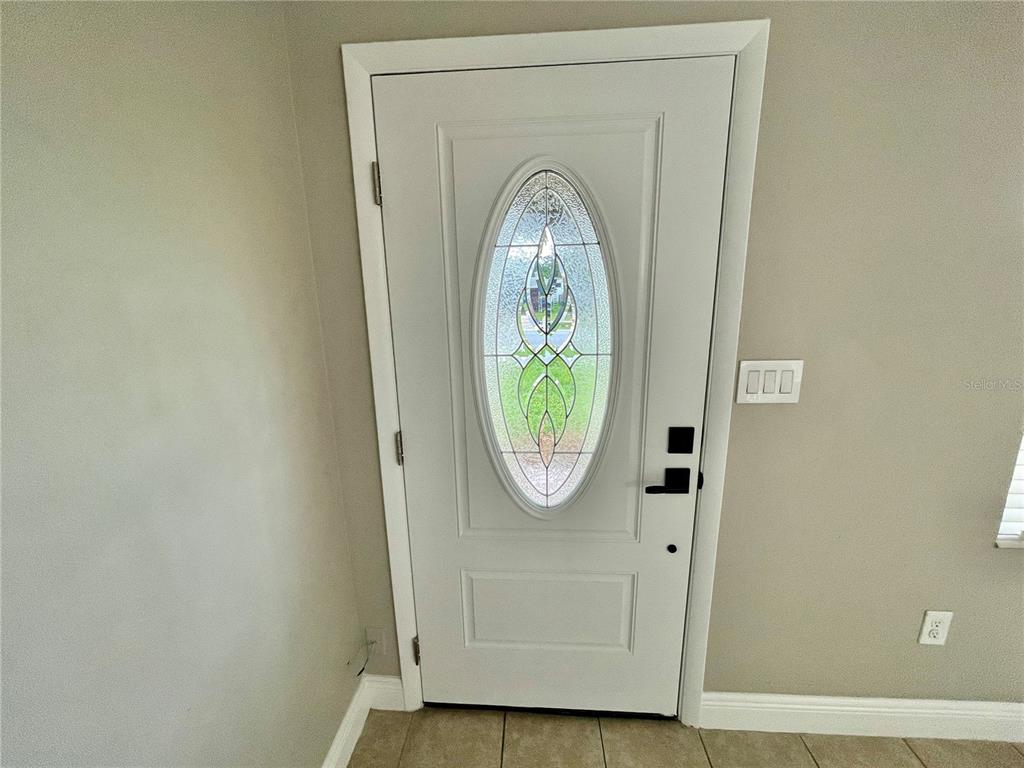 600 Ridgefield Avenue Ocoee, FL 34761 - Photo 27 of 45 New insulated beveled glass front entry door. Notice the updated door hardware throughout the house.