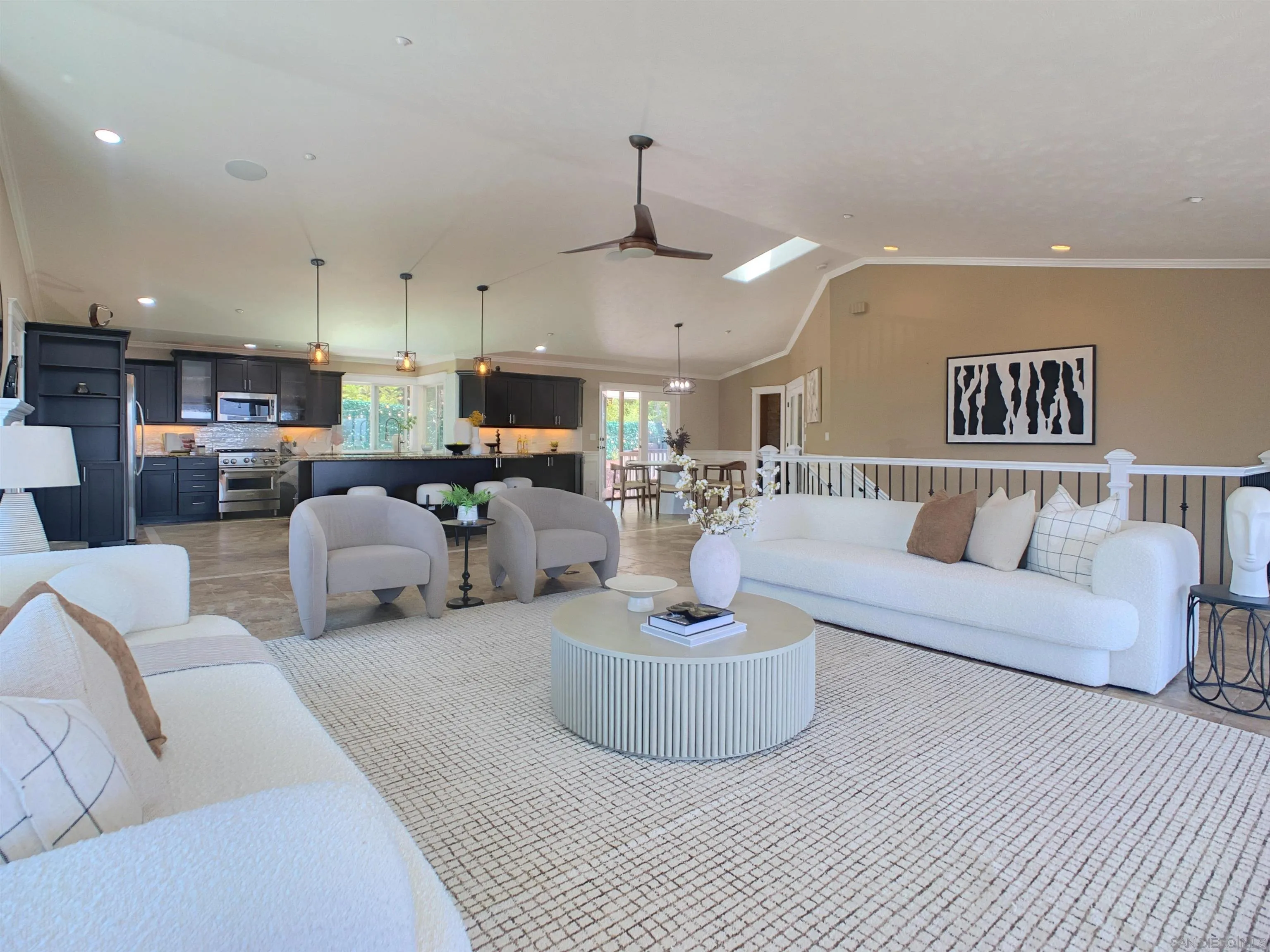 205 Highline Trail El Cajon, CA 92021 - Photo 11 of 45 a living room with furniture a fireplace and a chandelier
