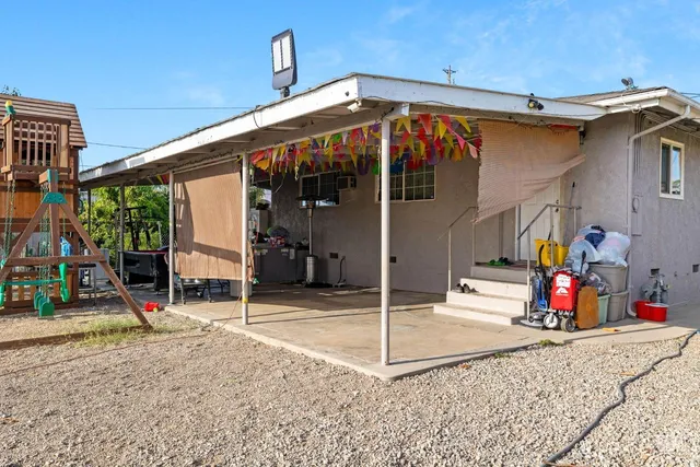 a street view with large trees