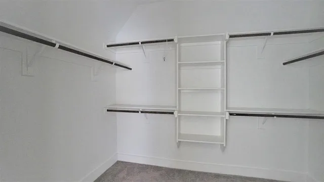 a view of an empty walk in closet