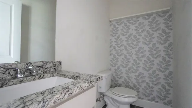a bathroom with a sink and a toilet