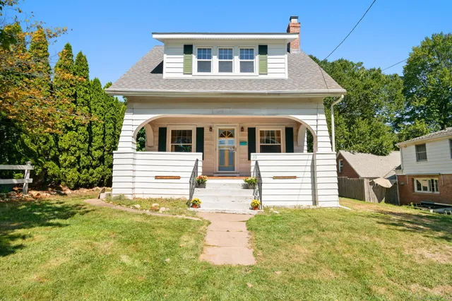 a house view with a garden space