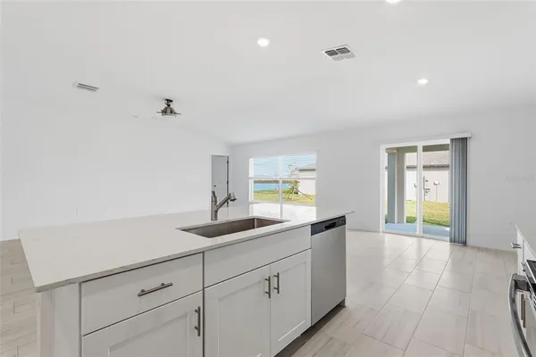 a kitchen with a sink and cabinets