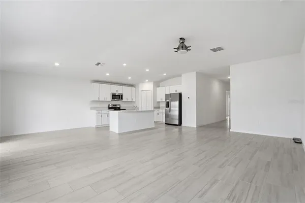 a view of a kitchen with a sink and a stove top oven