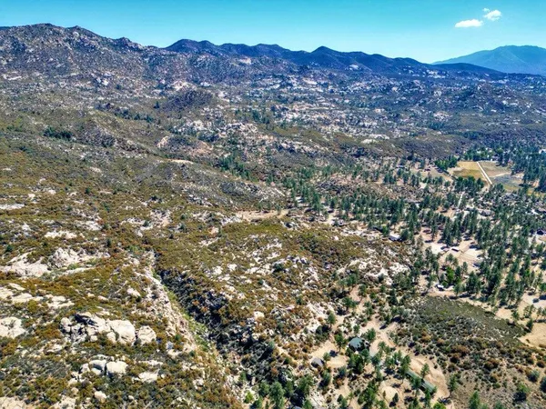 a view of a house in a field