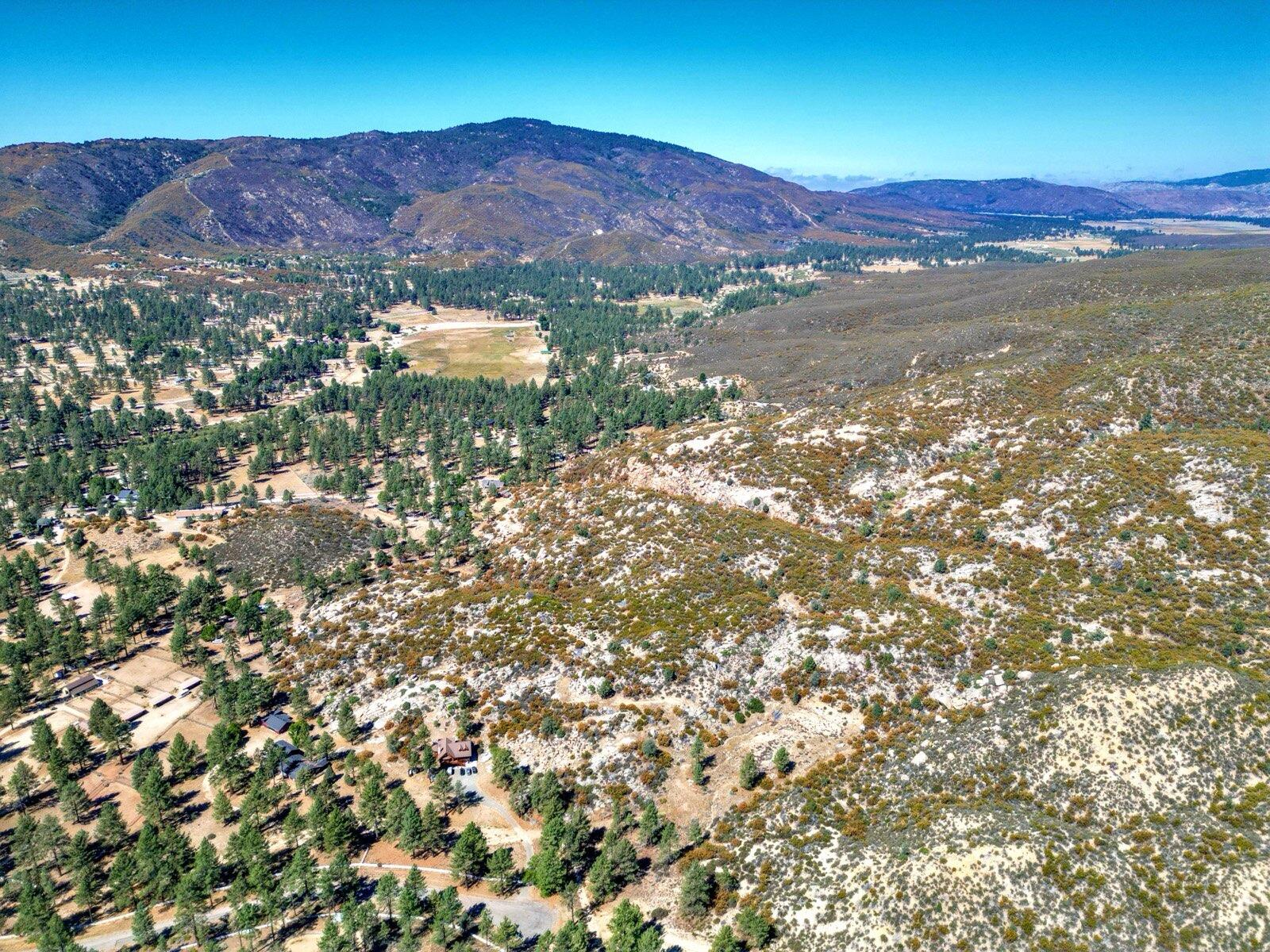 0 Table Mountain Road Mountain Center, CA 92561 - Photo 9 of 19 a view of a lush green field with mountains in the background