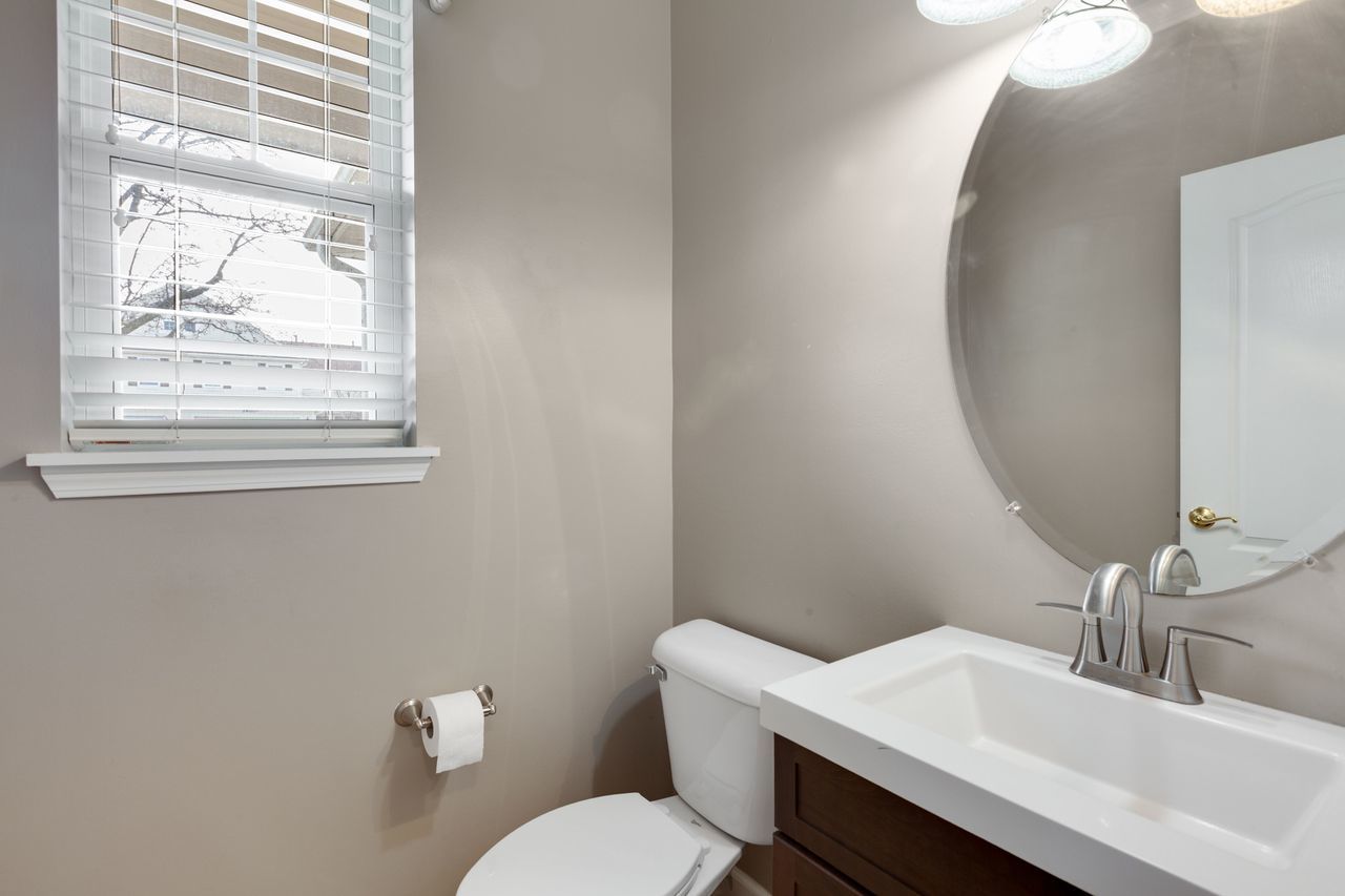 2805 Cattail Court, Unit D Wauconda, IL 60084 - Photo 11 of 30 a bathroom with a sink mirror and toilet