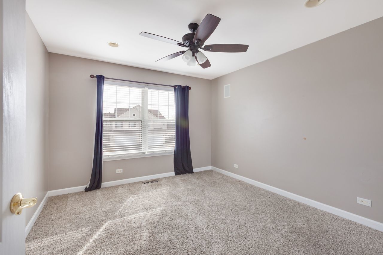 2805 Cattail Court, Unit D Wauconda, IL 60084 - Photo 19 of 30 a view of an empty room with a window