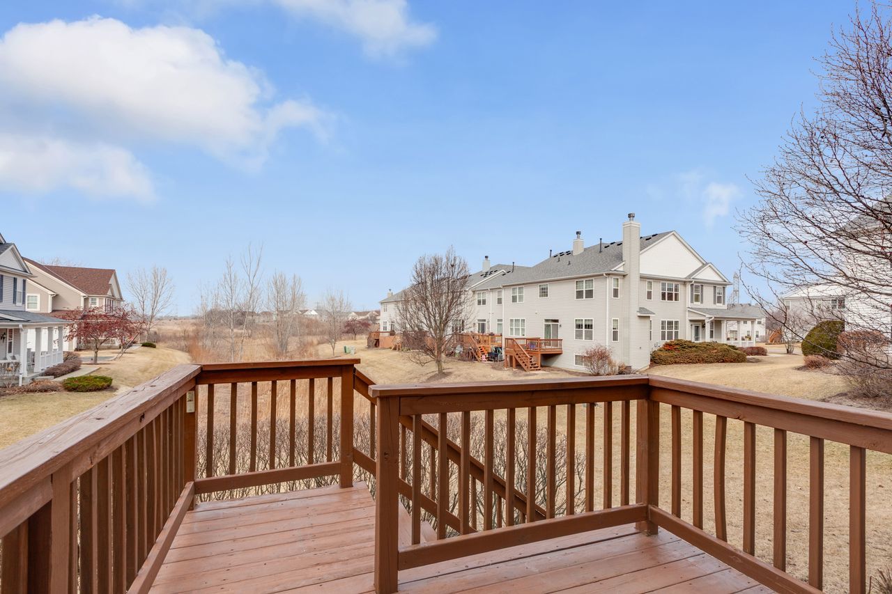 2805 Cattail Court, Unit D Wauconda, IL 60084 - Photo 24 of 30 a view of a balcony with wooden fence
