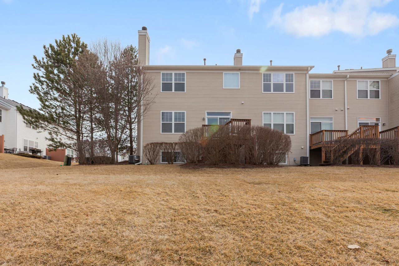 2805 Cattail Court, Unit D Wauconda, IL 60084 - Photo 25 of 30 a front view of a house with a yard