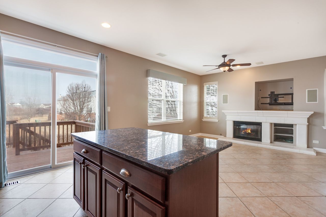 2805 Cattail Court, Unit D Wauconda, IL 60084 - Photo 8 of 30 a kitchen with a stove a sink and a refrigerator