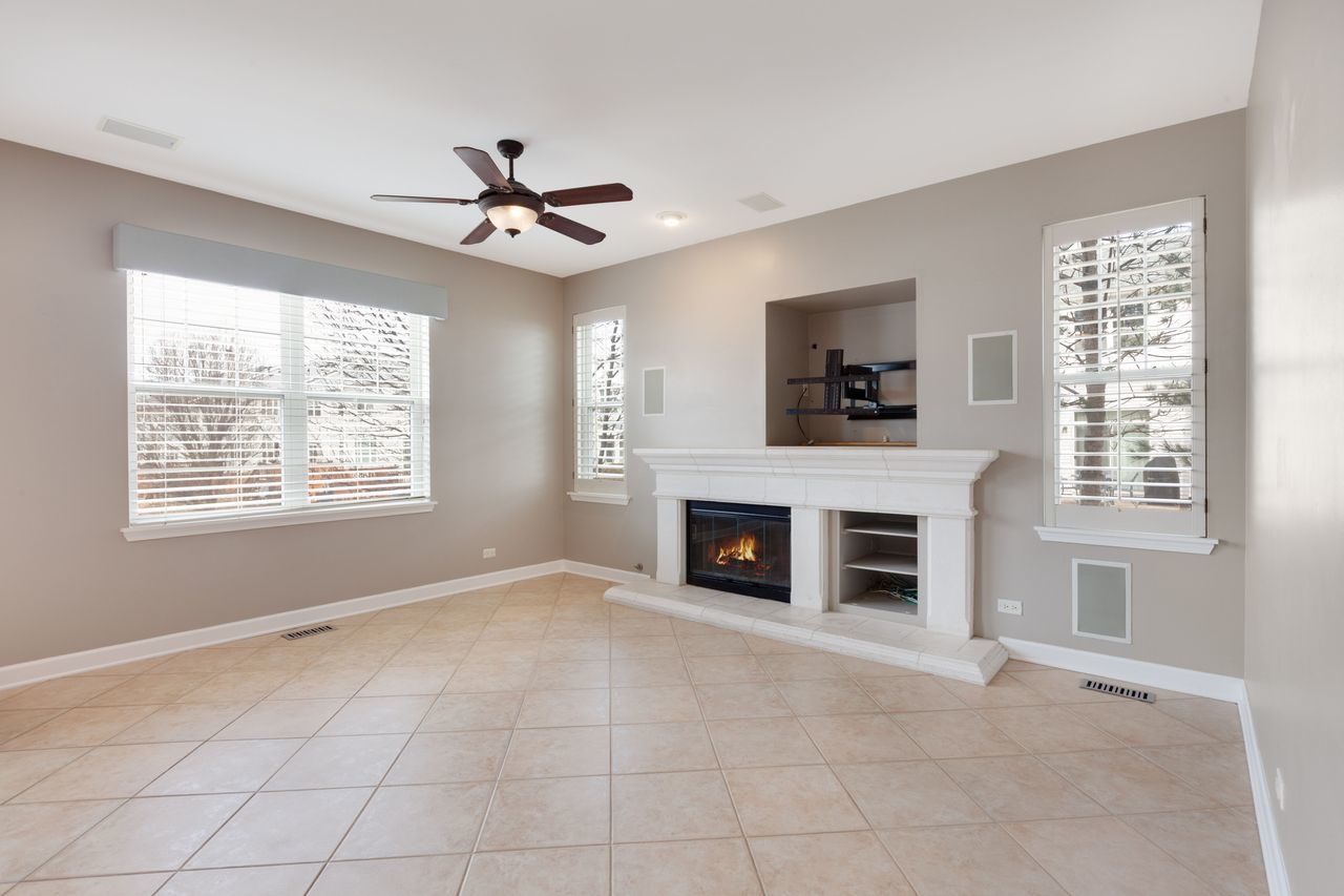 2805 Cattail Court, Unit D Wauconda, IL 60084 - Photo 9 of 30 wooden floor fireplace and windows in a room
