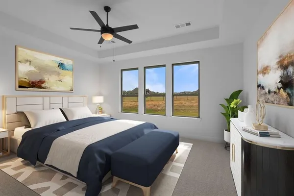 a bedroom with a bed and a large window