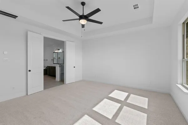 an empty room with a bathroom