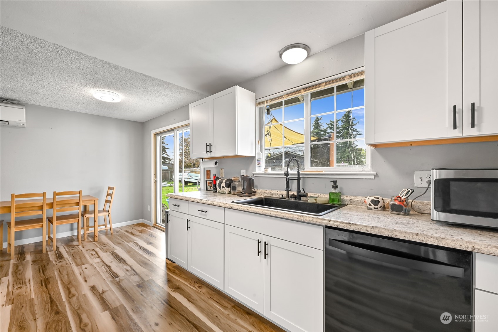 1474 Crestview Road Ferndale, WA 98248 - Photo 11 of 30 a kitchen with granite countertop a sink appliances cabinets and furniture