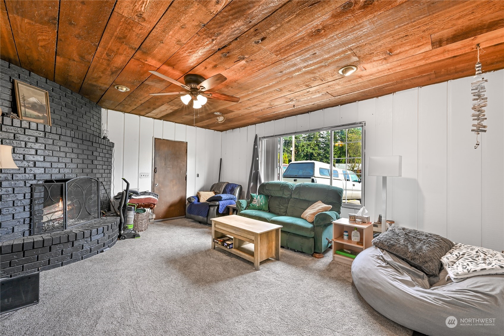 1474 Crestview Road Ferndale, WA 98248 - Photo 13 of 30 a living room with furniture and a fireplace