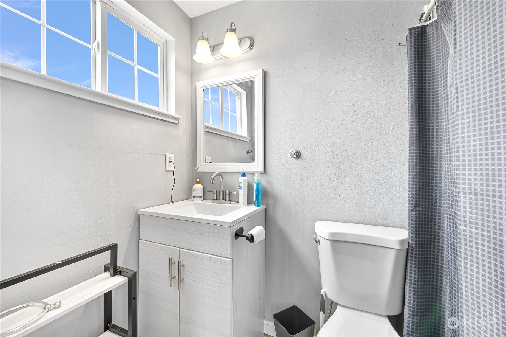 1474 Crestview Road Ferndale, WA 98248 - Photo 23 of 30 a white toilet sitting next to a bathroom sink