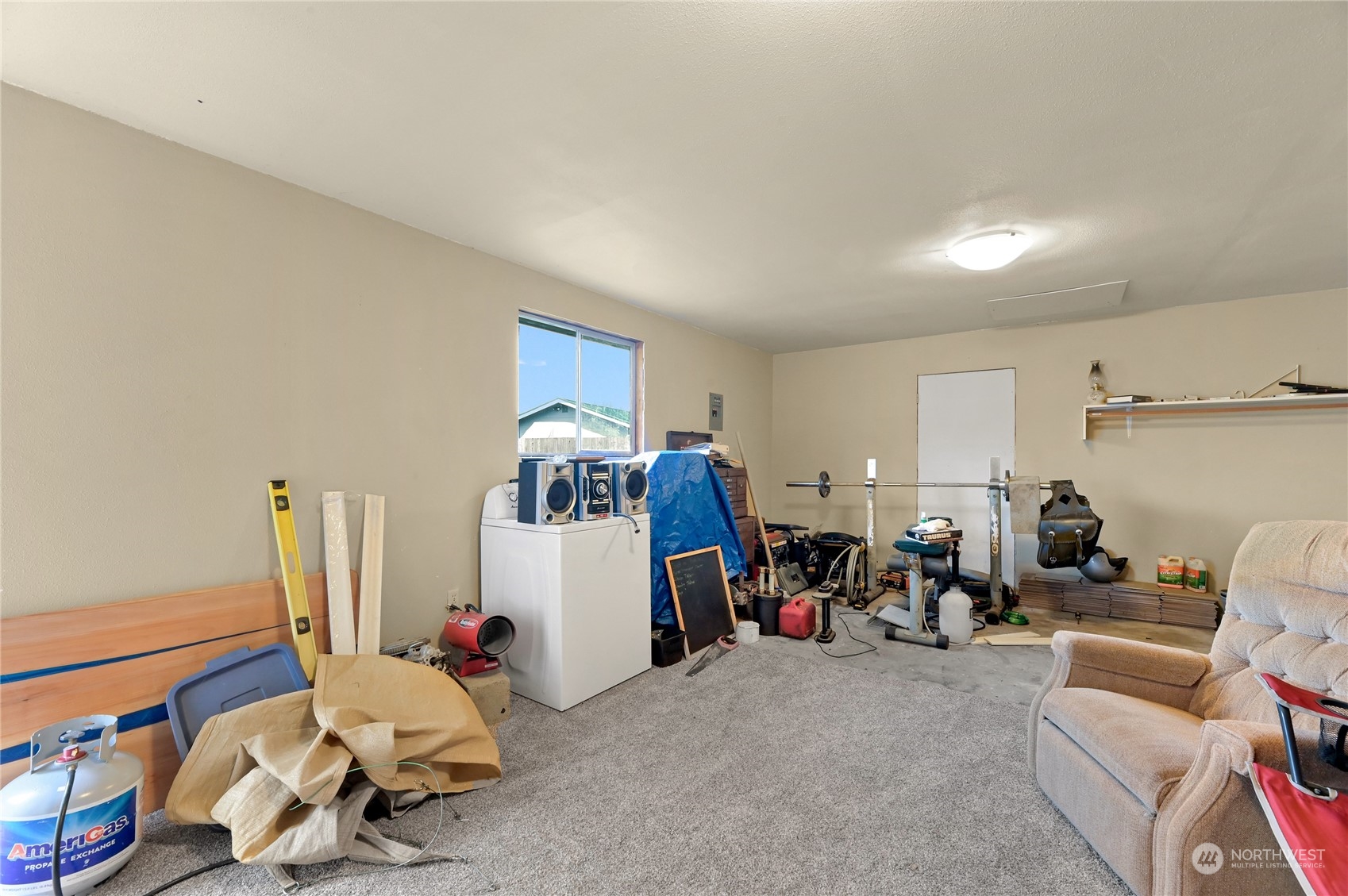 1474 Crestview Road Ferndale, WA 98248 - Photo 25 of 30 a living room filled with furniture and a gym machine