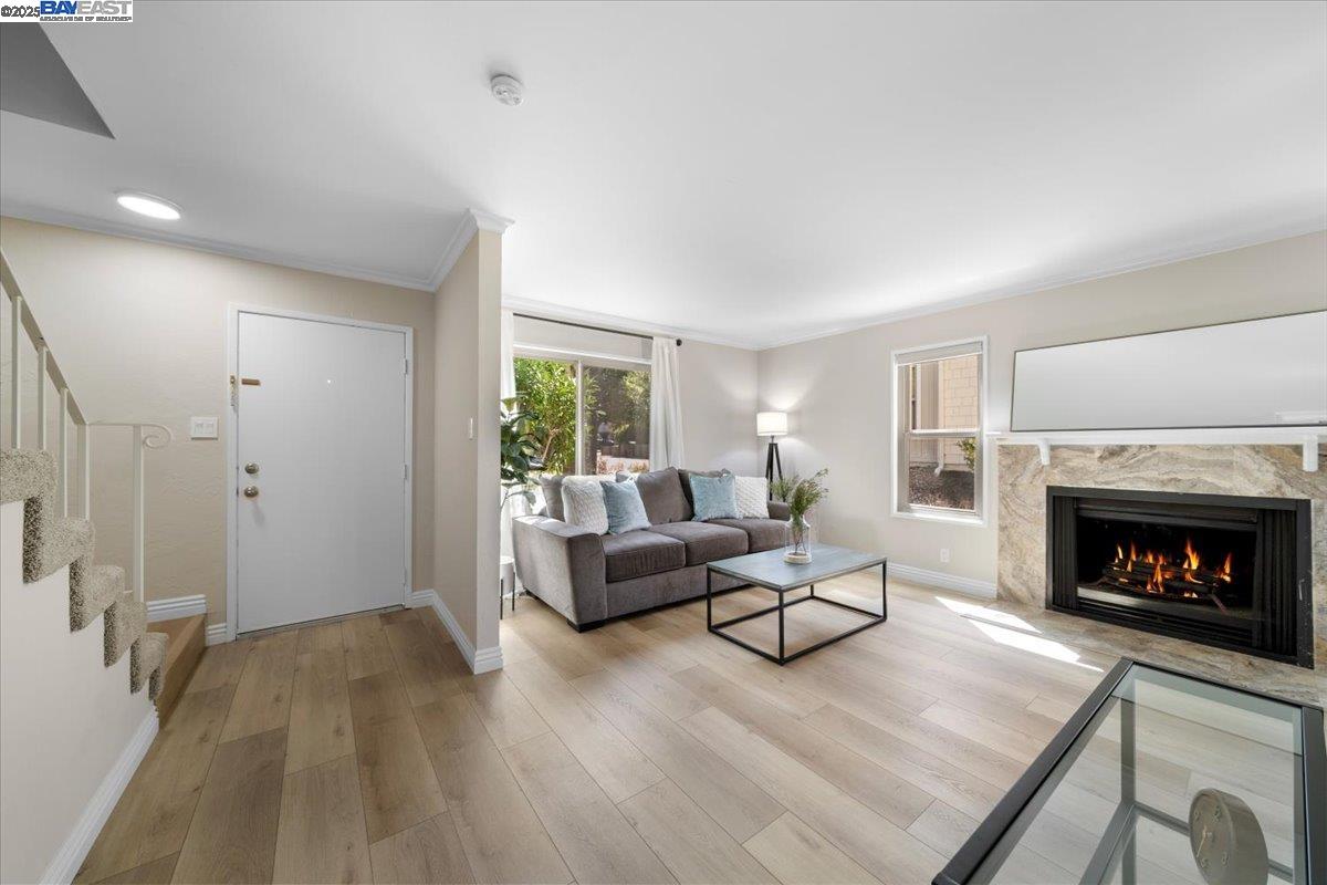 427 Chalda Way Moraga, CA 94556 - Photo 2 of 28 An inviting foyer opens up to the entire downstairs, creating a warm and welcoming atmosphere. Per AB 723 - Fire in fireplace has been digitally rendered.