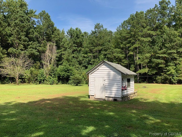 460 Holly Point Road Mathews, VA 23109 - Photo 8 of 16 a view of a backyard with garden