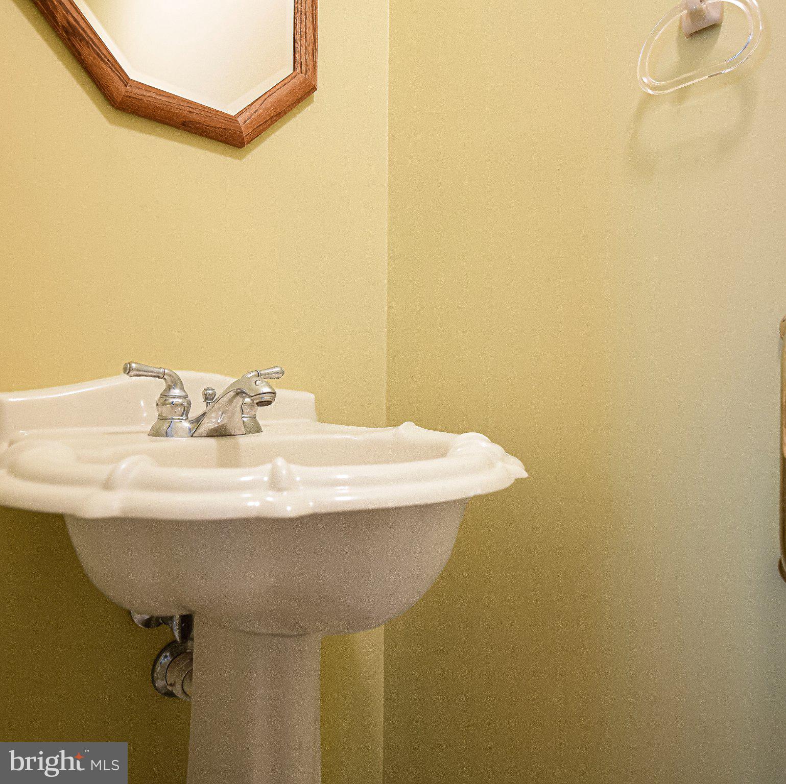 711 Gilbert Road Aberdeen, MD 21001 - Photo 11 of 54 a bathroom with a sink and a mirror