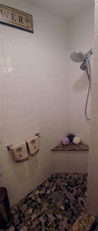 6543 Pine Walk Drive New Port Richey, FL 34655 - Photo 14 of 21 a bathroom with a granite countertop sink and cabinets