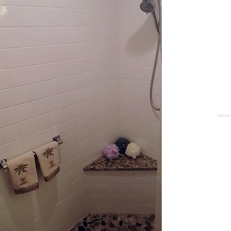 6543 Pine Walk Drive New Port Richey, FL 34655 - Photo 15 of 21 a bathroom with a bathtub