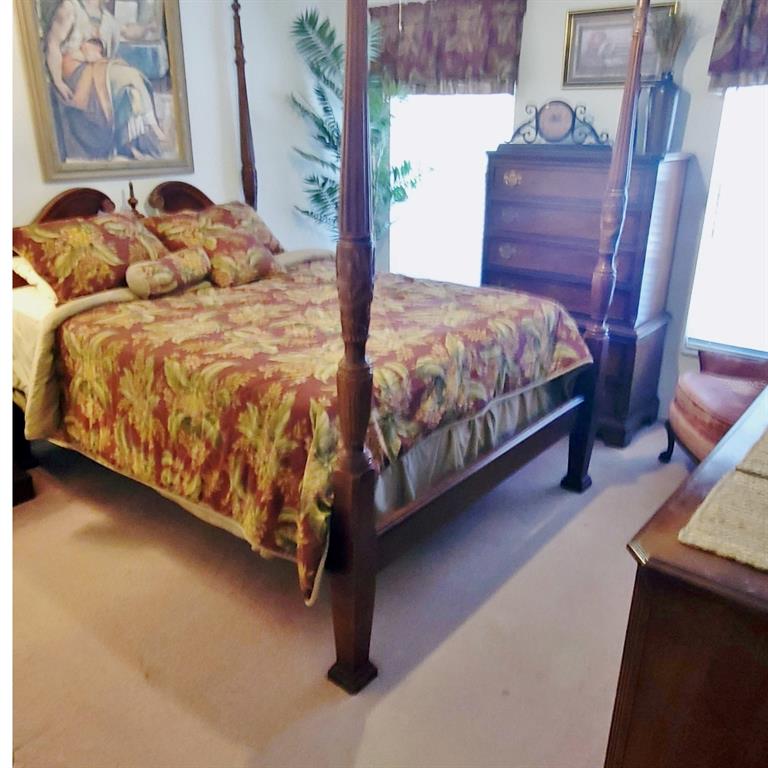 6543 Pine Walk Drive New Port Richey, FL 34655 - Photo 16 of 21 a bedroom with a bed and window