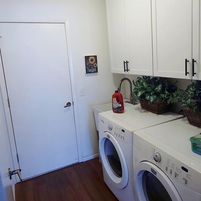6543 Pine Walk Drive New Port Richey, FL 34655 - Photo 18 of 21 a utility room with dryer and washer