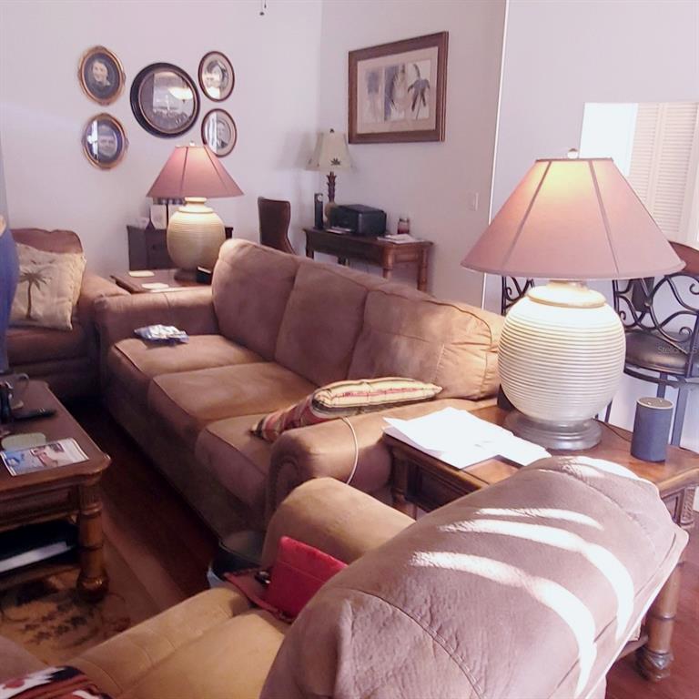 6543 Pine Walk Drive New Port Richey, FL 34655 - Photo 6 of 21 a bedroom with bed and a couch