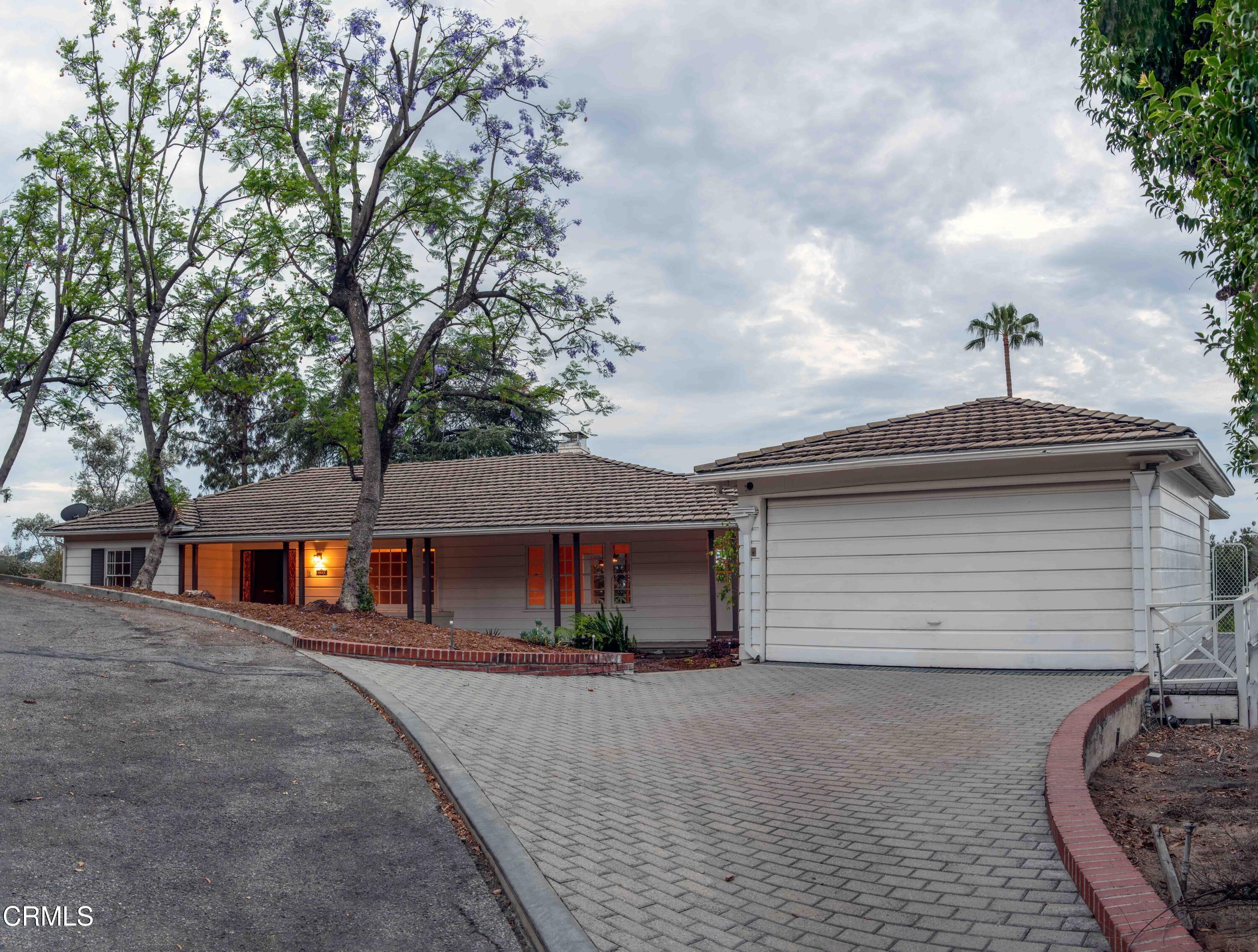 1521 Roca Drive Glendale, CA 91207 - Photo 2 of 54 a front view of a house with a garden