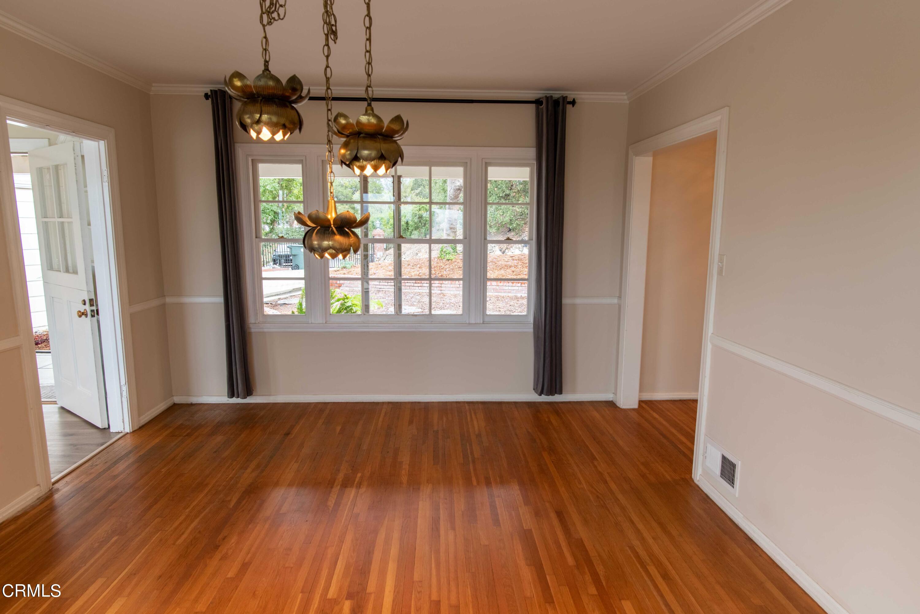 1521 Roca Drive Glendale, CA 91207 - Photo 15 of 54 a view of an empty room with a window and wooden floor