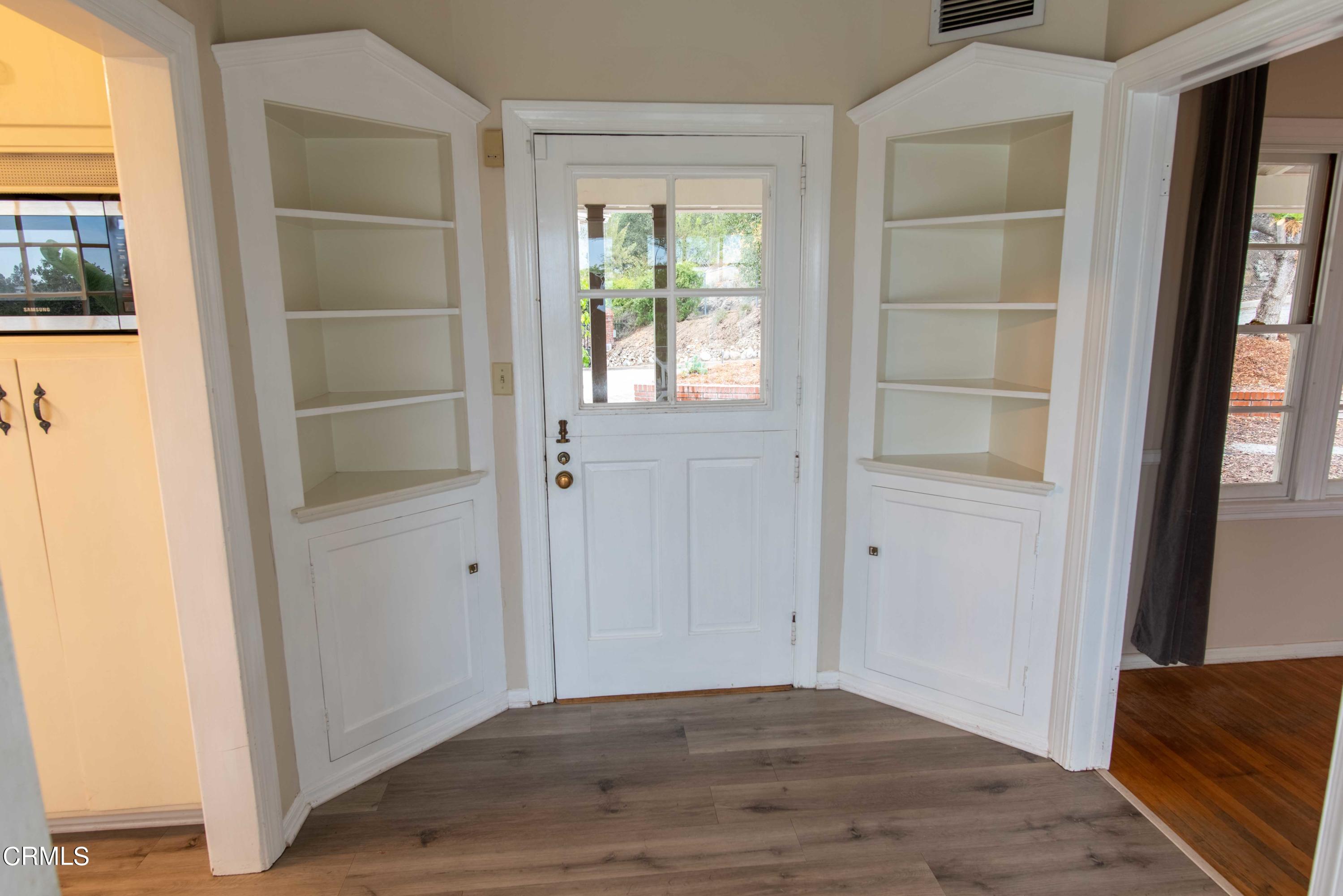 1521 Roca Drive Glendale, CA 91207 - Photo 16 of 54 a view of an empty room with wooden floor and a window
