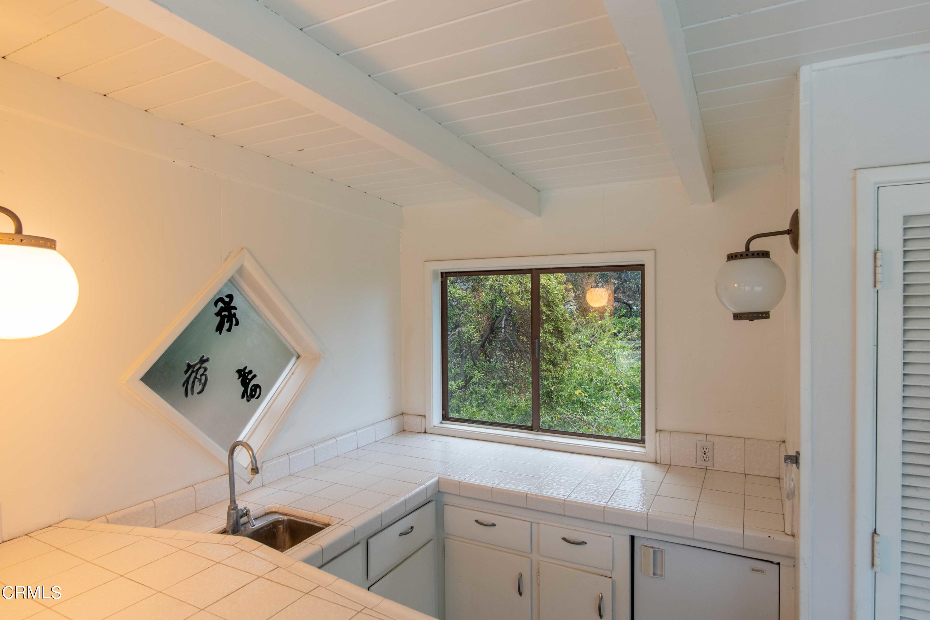 1521 Roca Drive Glendale, CA 91207 - Photo 20 of 54 a view of a sink cabinets and a window