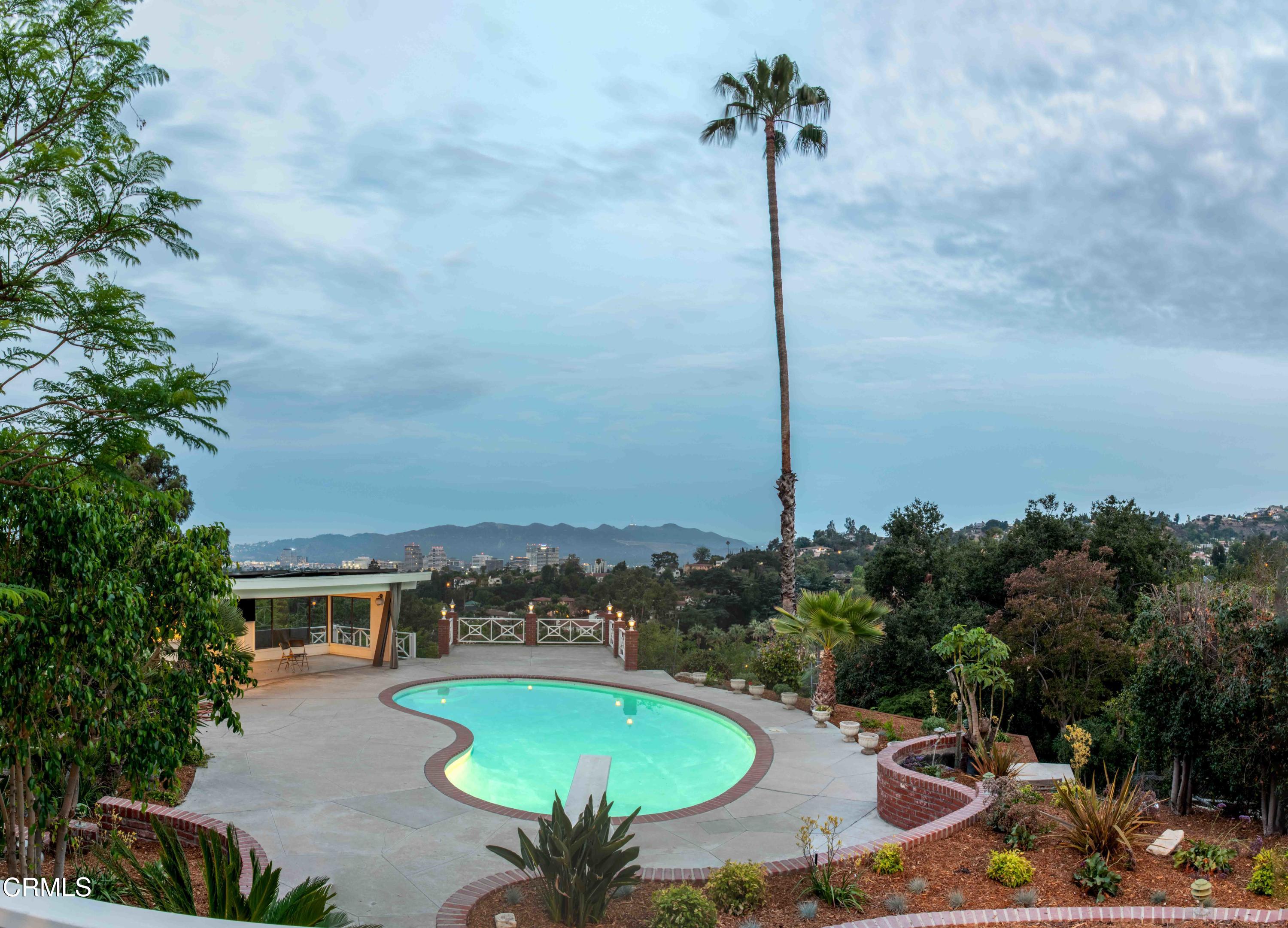 1521 Roca Drive Glendale, CA 91207 - Photo 3 of 54 a view of a swimming pool with a yard