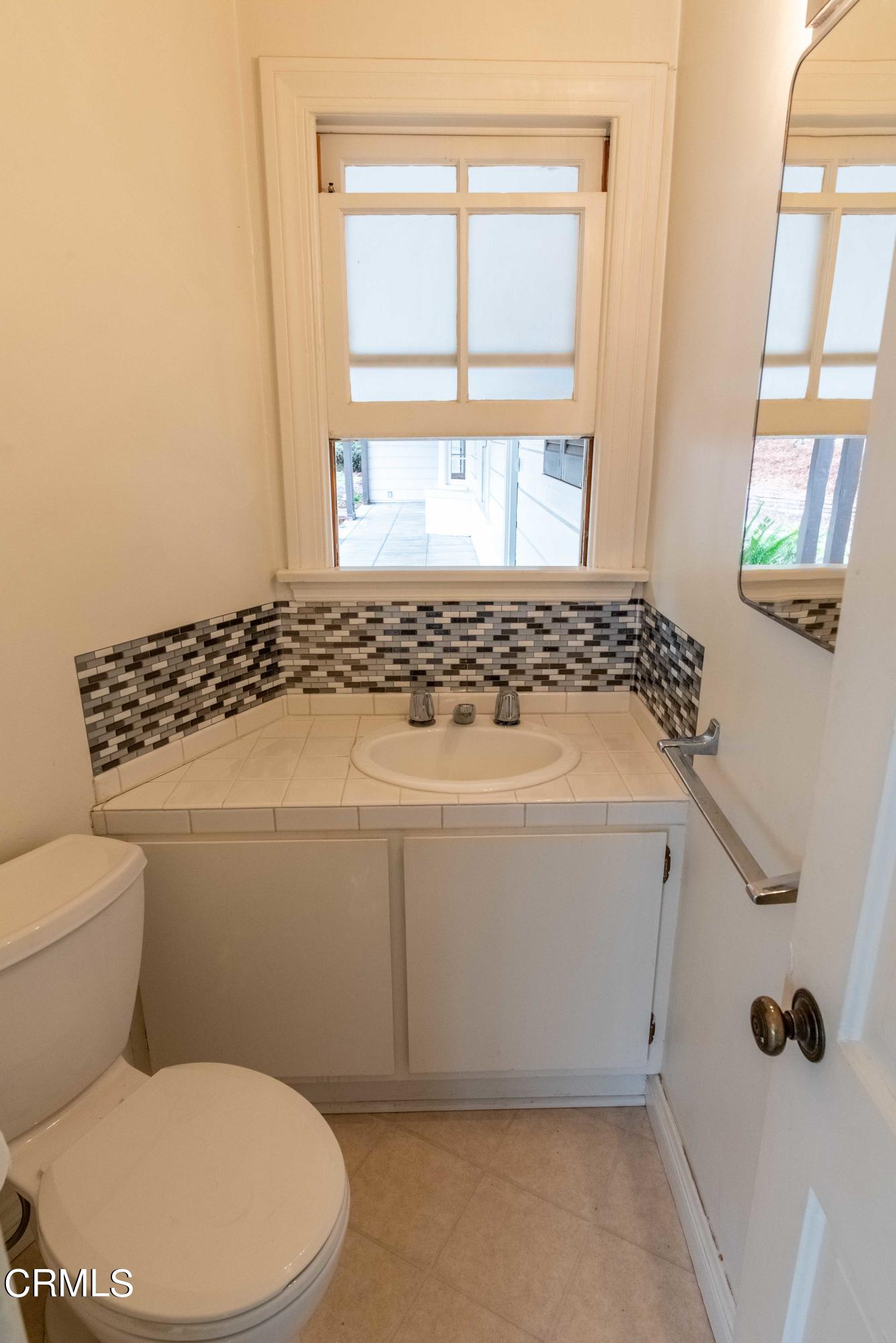 1521 Roca Drive Glendale, CA 91207 - Photo 29 of 54 a bathroom with a toilet and a window