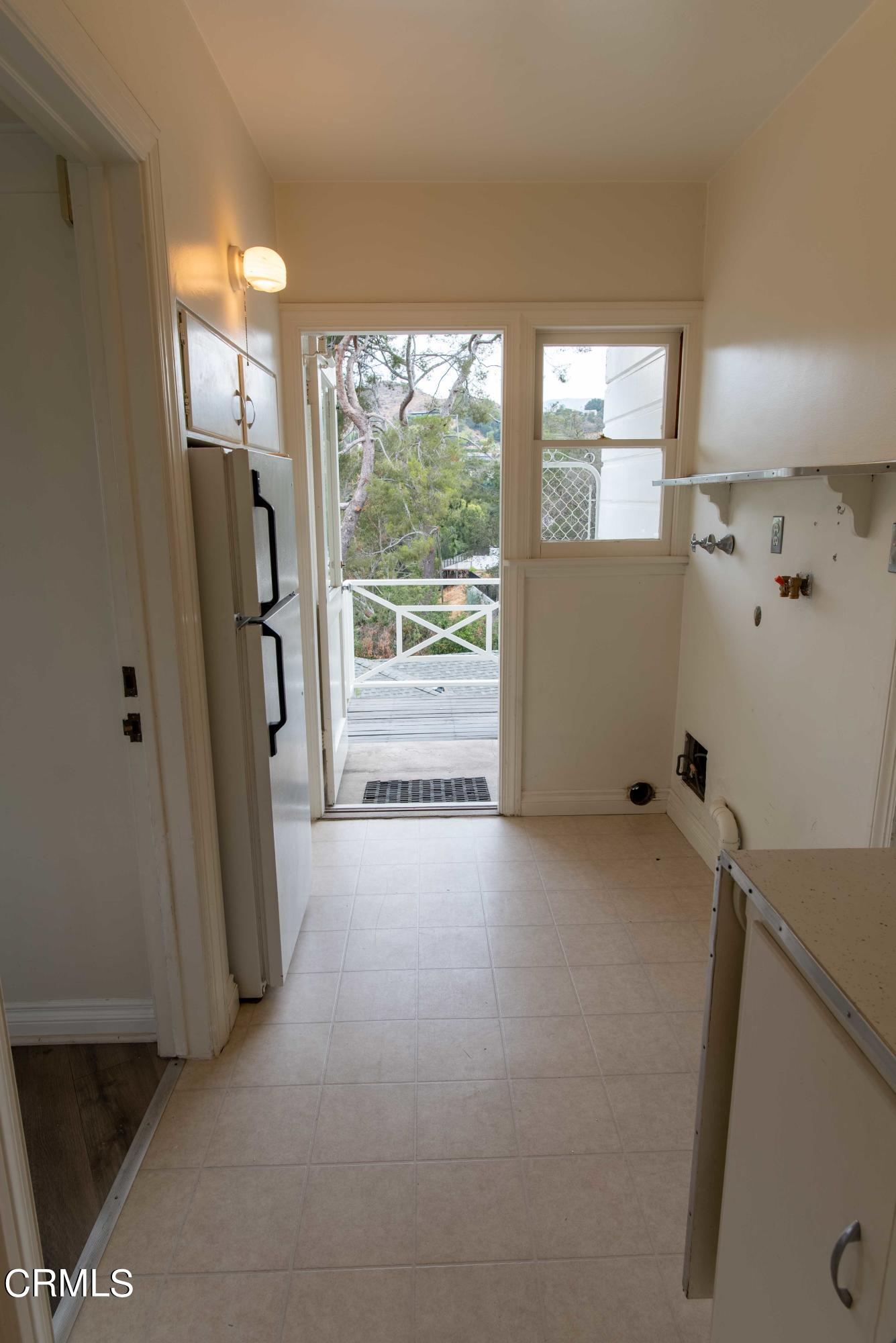 1521 Roca Drive Glendale, CA 91207 - Photo 30 of 54 a view of a room with window and refrigerator