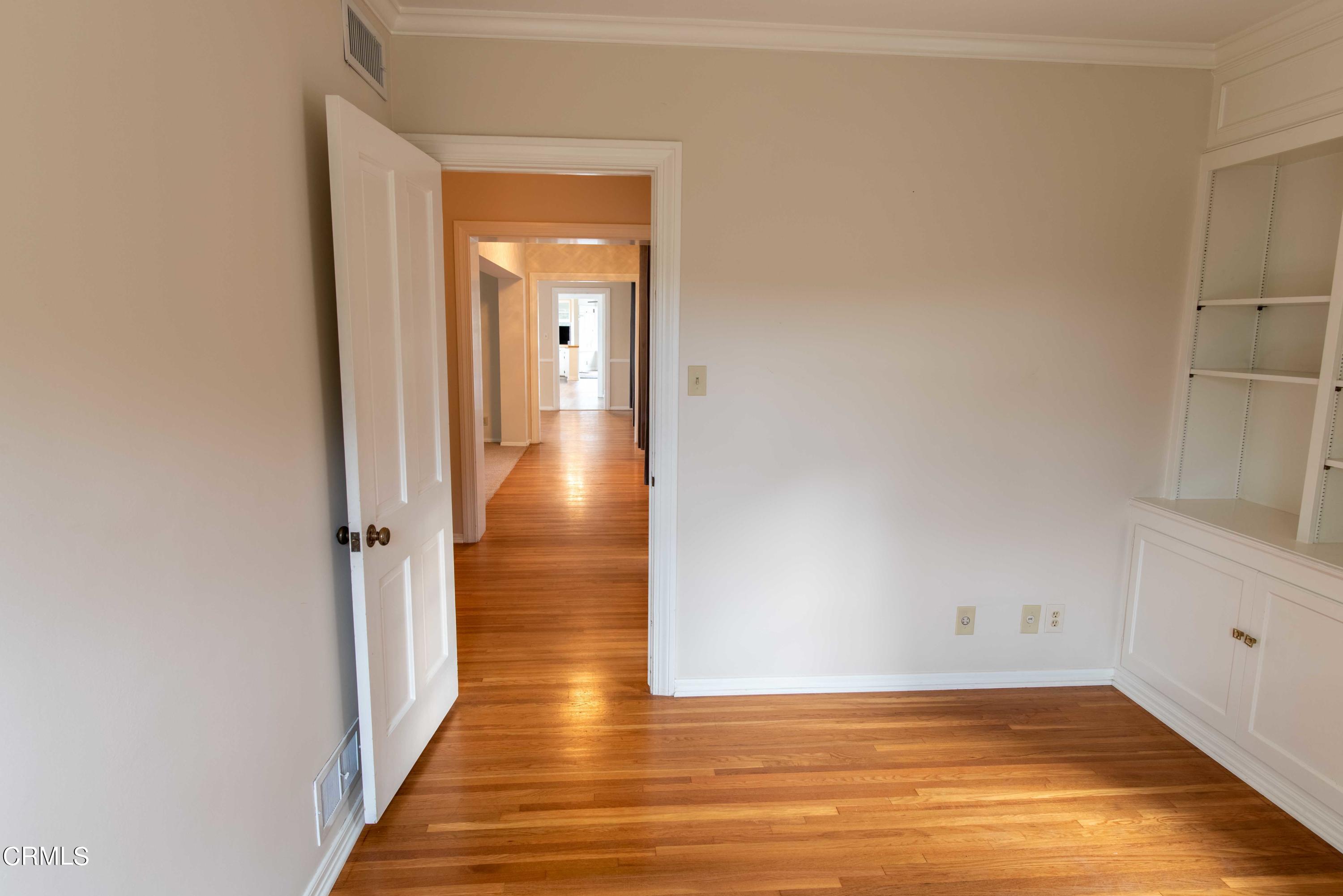 1521 Roca Drive Glendale, CA 91207 - Photo 33 of 54 a view of a hallway with wooden floor