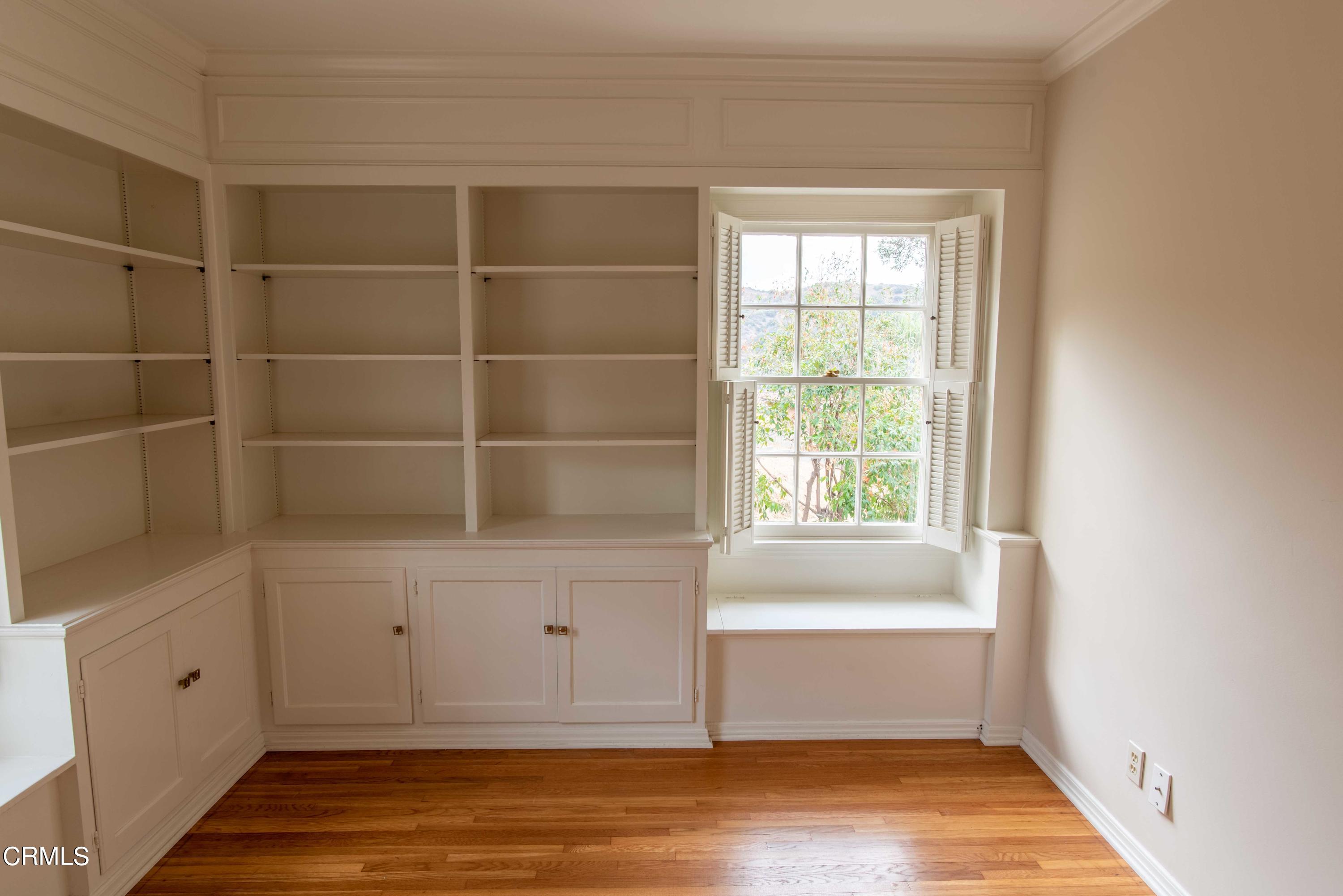 1521 Roca Drive Glendale, CA 91207 - Photo 34 of 54 a view of an empty room with wooden floor and window