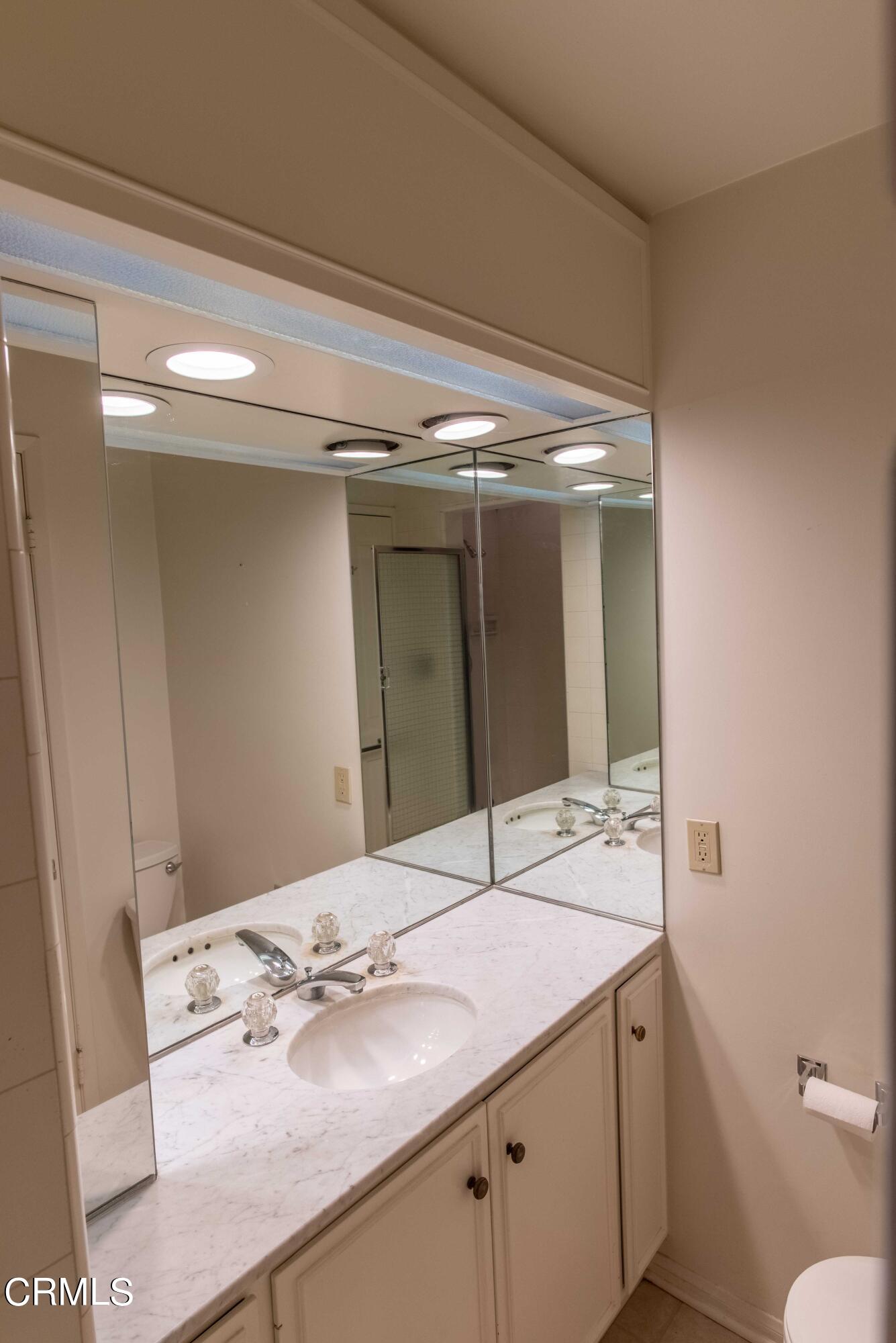1521 Roca Drive Glendale, CA 91207 - Photo 36 of 54 a bathroom with a sink and a mirror